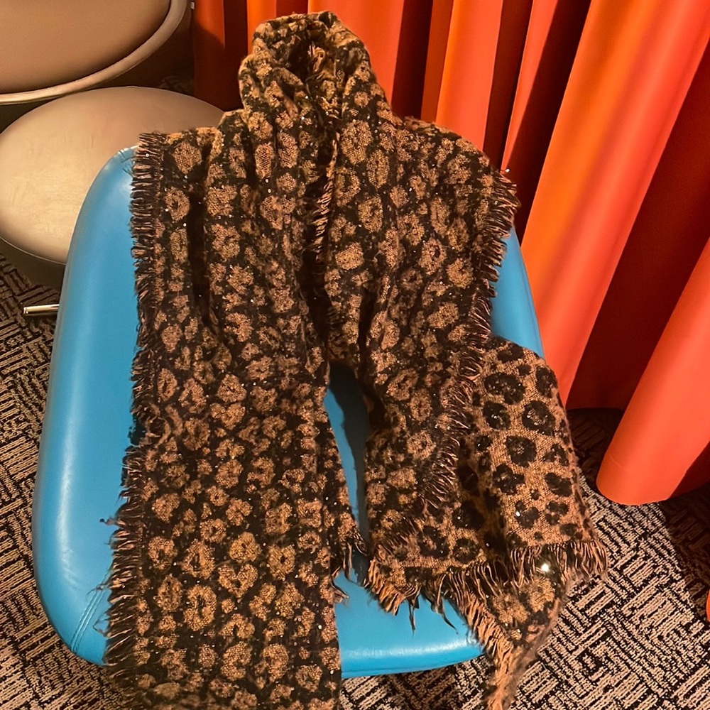 Polyester leopard print shawl with hand sewn sequins.